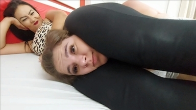 Rubber Leggings Lock: Kiara's Strong Legs Scissor Hold